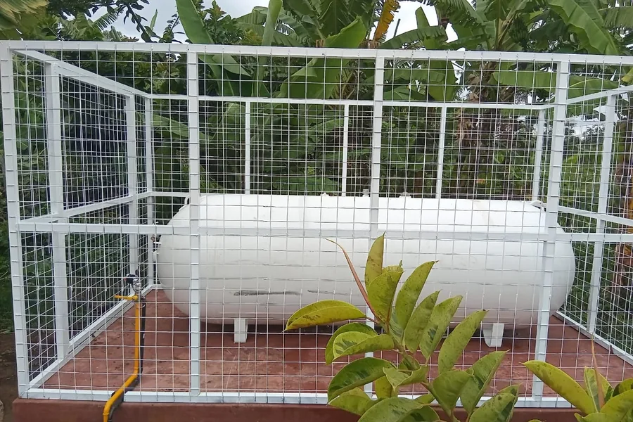 Completed bulk LPG storage tank inside a steel safety enclosure