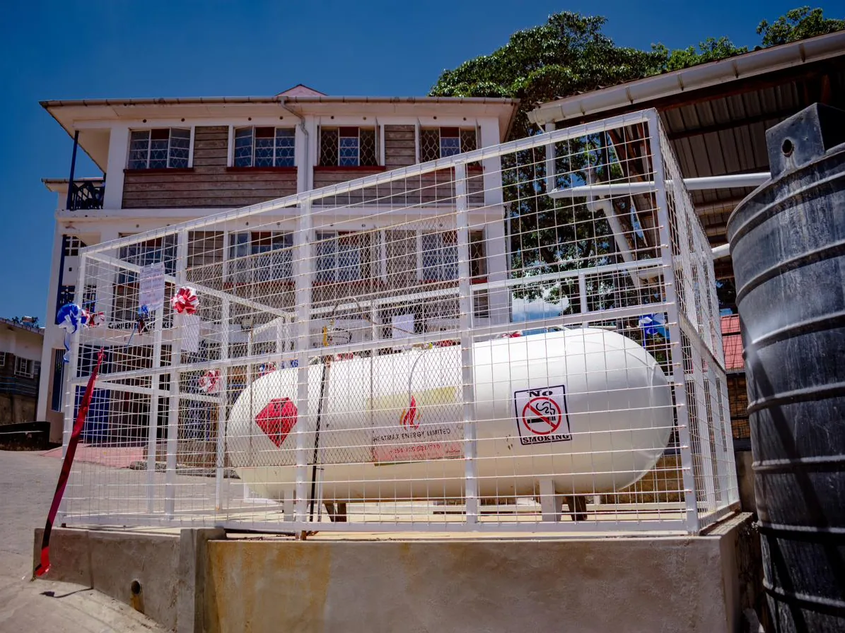 Bulk LPG storage tank secured inside a protective steel enclosure